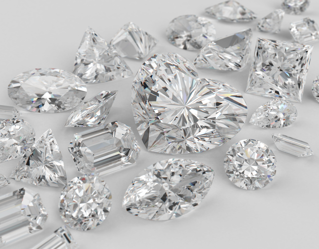 Diamonds different cuts on gray background. Focus on large diamond heart shape.