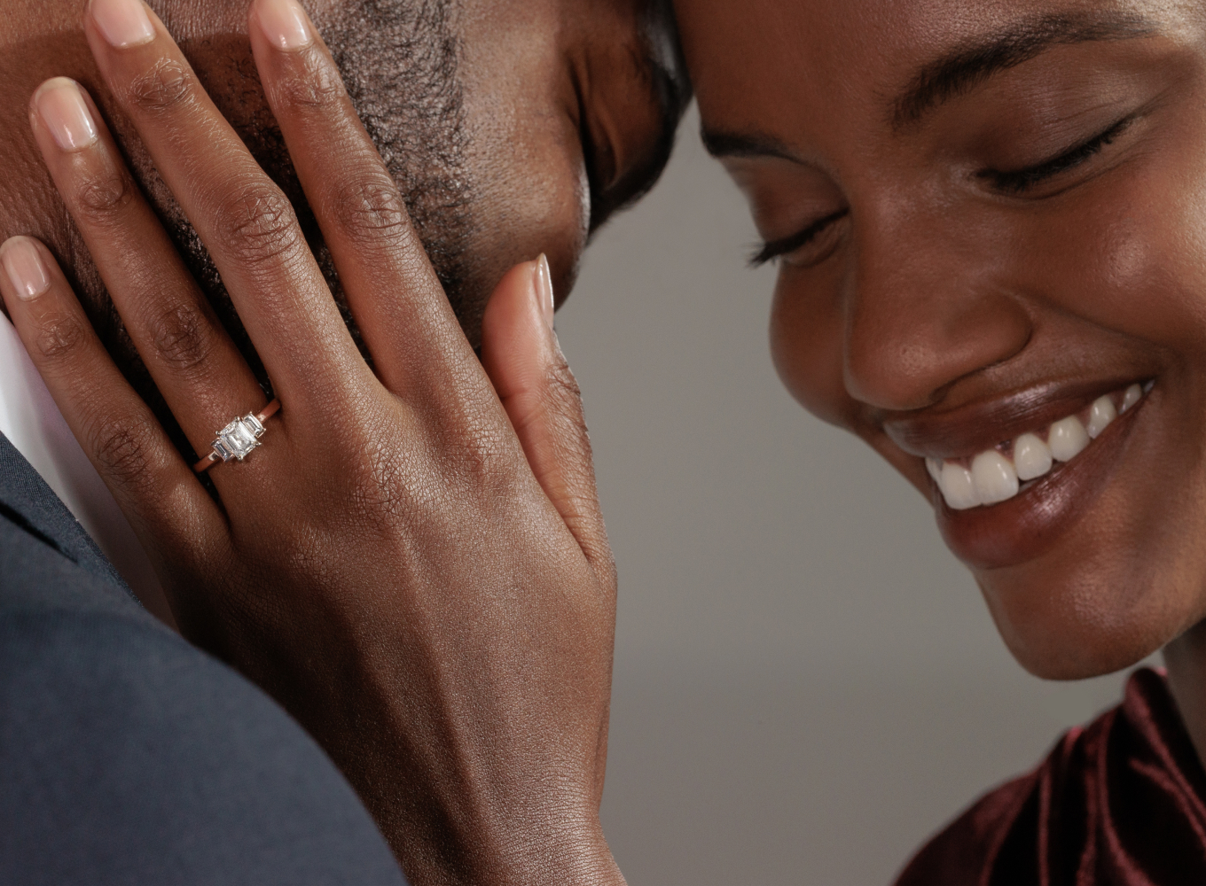 Couple smiling after proposal. Engagement ring on finger. Serendipity Diamond Engagement Ring in 14K Rose Gold
Create a one-of-a-kind engagement ring with this beautiful setting crafted from quality 14 karat rose gold. This ring features two accenting baguette natural diamonds, at approximately 0.15 carat total weight. This piece measures 1mm wide at the band and can receive a custom engraving. Simply add the center gemstone of your choice to complete the look. For more information on selecting your center stone or engraving, Live Chat or call an online customer service representative at 1-866-467-4263, or visit one of our store locations.