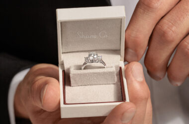 Three-stone engagement ring in a Shane Co. ring box