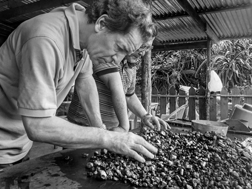 Tom Shane Looking Through Rough Stones to help make the perfect gifts for our customers.