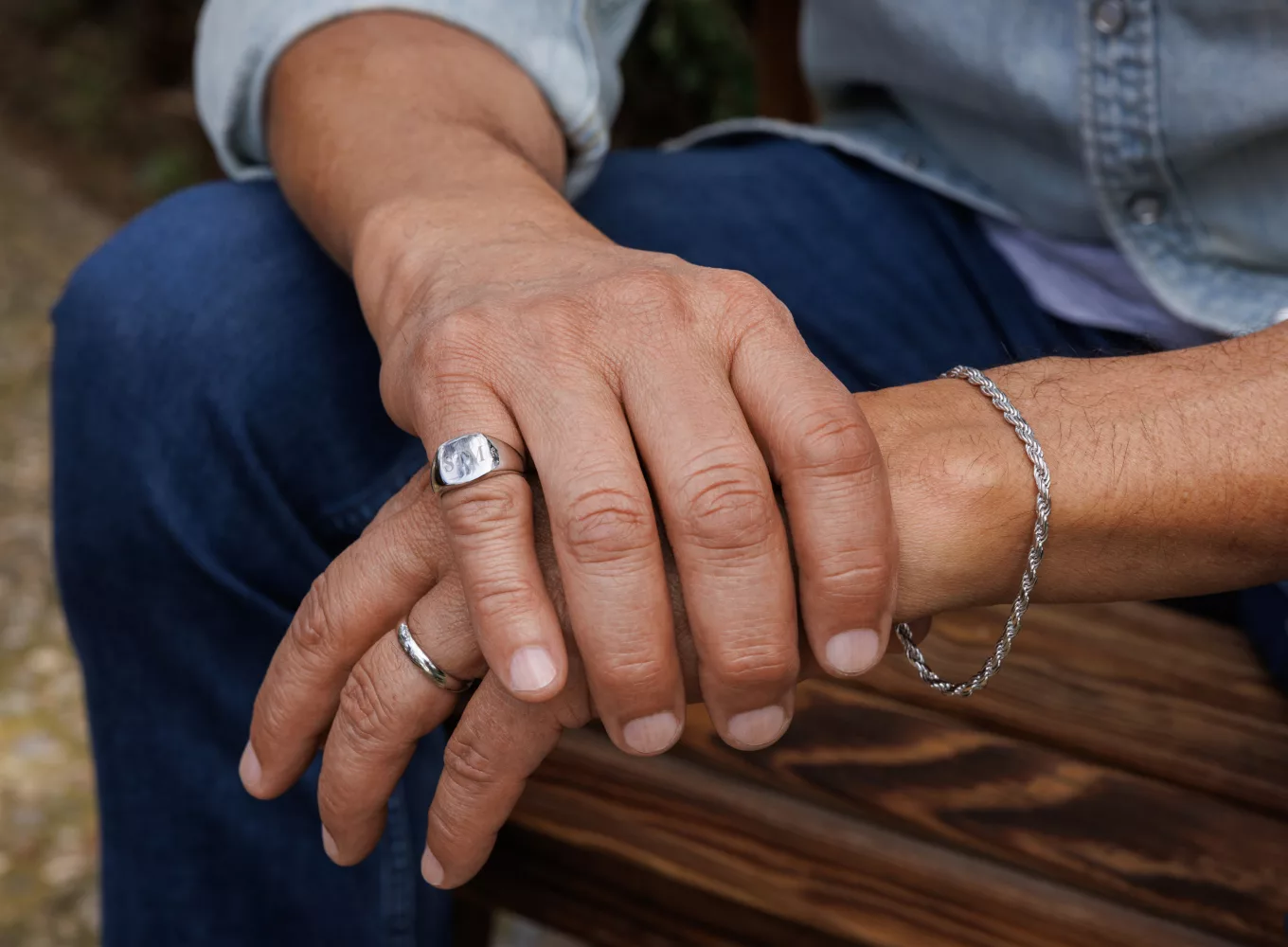 man wearing engravable ring, bracelet, and wedding ring 20in 14K White Gold Figaro Chain (5.3mm) Easily elevate any look with this stylish Figaro chain. Crafted in bright 14-karat white gold, a secure lobster clasp offers worry-free wear. 