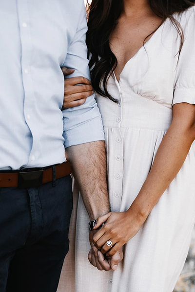 Couple holding hands.