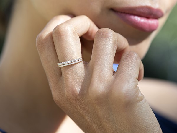 Woman wearing stacked baguette wedding bands.