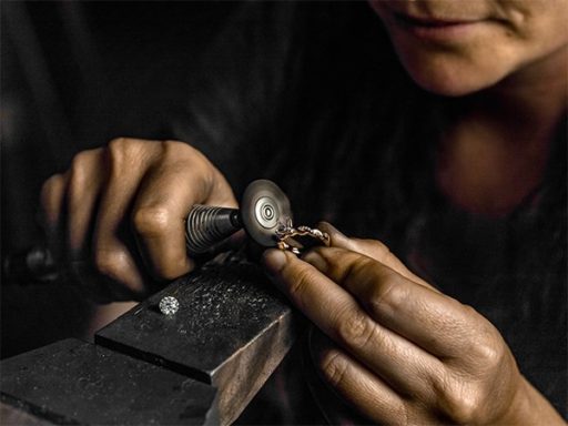 Jeweler working on ring.