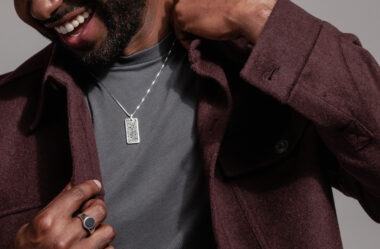 man wearing dog tag style fashion necklace