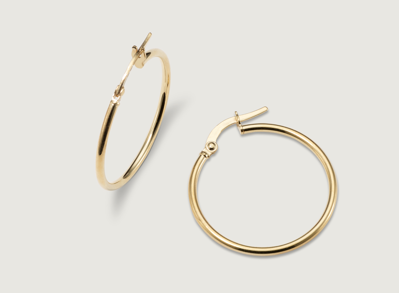 gold hoop earrings. Daily 14K Yellow Gold Hoops
These hoop earrings feature a classic look with a slim, rounded profile and a lightweight feel, making them perfect for daily wear. A lever back keeps these beautiful 14-karat yellow gold hoops secure.