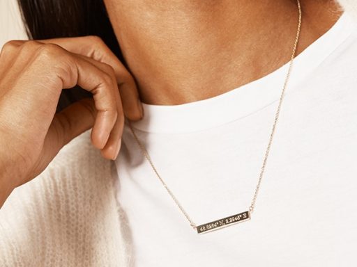 Engravable 14k yellow gold bar necklace.