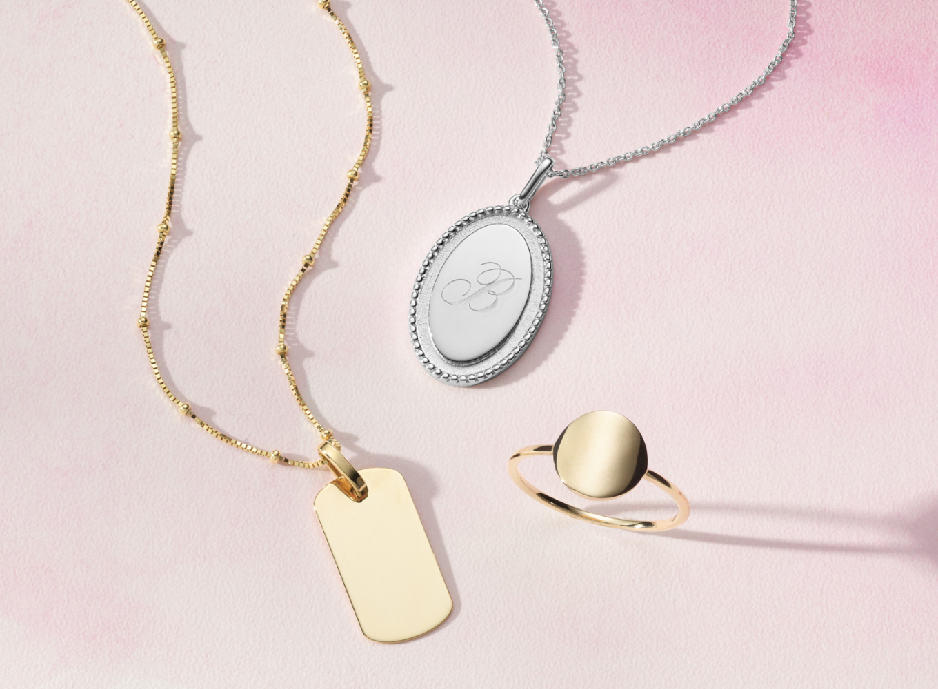 14K Yellow Gold Engravable Disk Ring This 14-karat yellow gold disk ring can shine all on its own or be the perfect canvas for a custom engraving. Odelia Engravable Sterling Silver Pendant This sterling silver pendant features a stylish oval shape and delicate milgrain detailing that offers vintage flair. Add a custom engraving to the middle, or let it shine all on its own. A matching rolo chain with a lobster clasp keeps this beautiful necklace secure. 14K Yellow Gold Dog Tag Charm Personalize this 14-karat yellow gold dog tag charm with a custom engraving, or let it shine all on its own. This charm can accommodate either horizontal or vertical text. Create a beautiful necklace by adding a chain. For more information about custom engraving, live chat online, call a customer service representative at 1-866-467-4263, or visit one of our store locations.