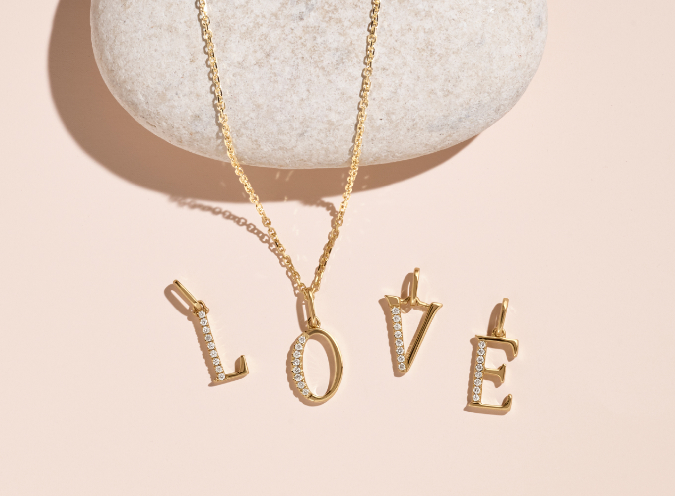 Diamond Accent Letter L Charm
This letter L initial charm is crafted in warm 14-karat yellow gold and partially lined with natural diamond accents for a touch of sparkle. Add it to a chain to create a beautiful pendant, perfect for a gift or daily accessory.
Diamond Letter O Pendant in 14k Yellow Gold (18 in)
Crafted in quality 14 karat yellow gold, eight brilliant round natural diamonds, at approximately .03 carats, create an eye-catching letter O pendant. This natural diamond letter charm measures 5/8 inch long (including the O-ring ) and hang from a matching 18-inch cable chain.
Diamond Letter V Pendant in 14k Yellow Gold (18 in)
Crafted of 14 karat yellow gold, this gorgeous letter V pendant beautifully displays 8 brilliant round natural diamonds at approximately .03 carats and measures 5/8 inch long, including the o-ring and hangs from a matching 18 inch cable chain.
Diamond Accent Letter E Charm
This letter E initial charm is crafted in warm 14-karat yellow gold and partially lined with natural diamond accents for a touch of sparkle. Add it to a chain to create a beautiful pendant, perfect for a gift or daily accessory.