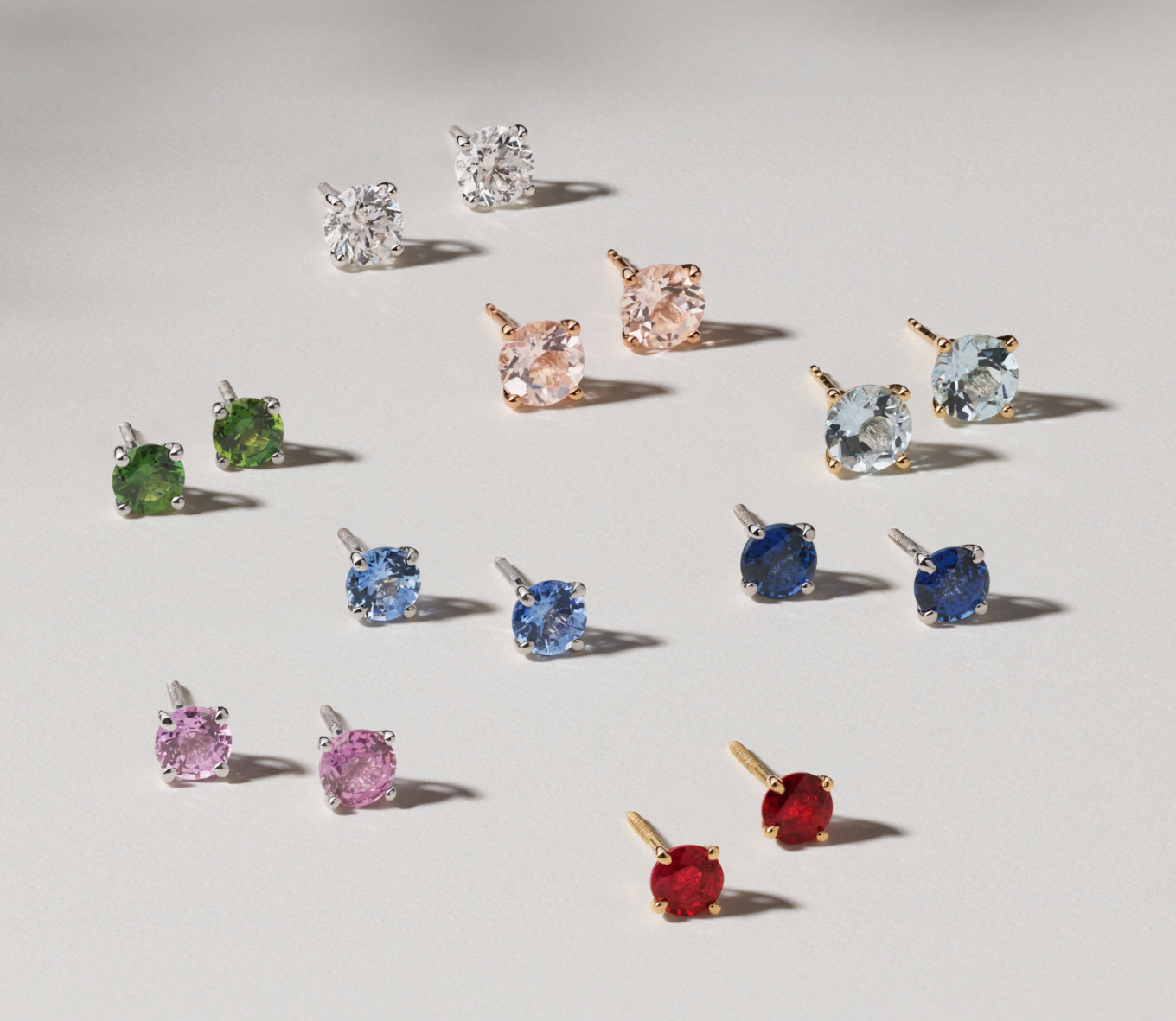 Assorted gemstone stud earrings. Diamond stud earrings, Ruby stud earrings, peridot stud earrings, aquamarine stud earrings, sapphire stud earrings