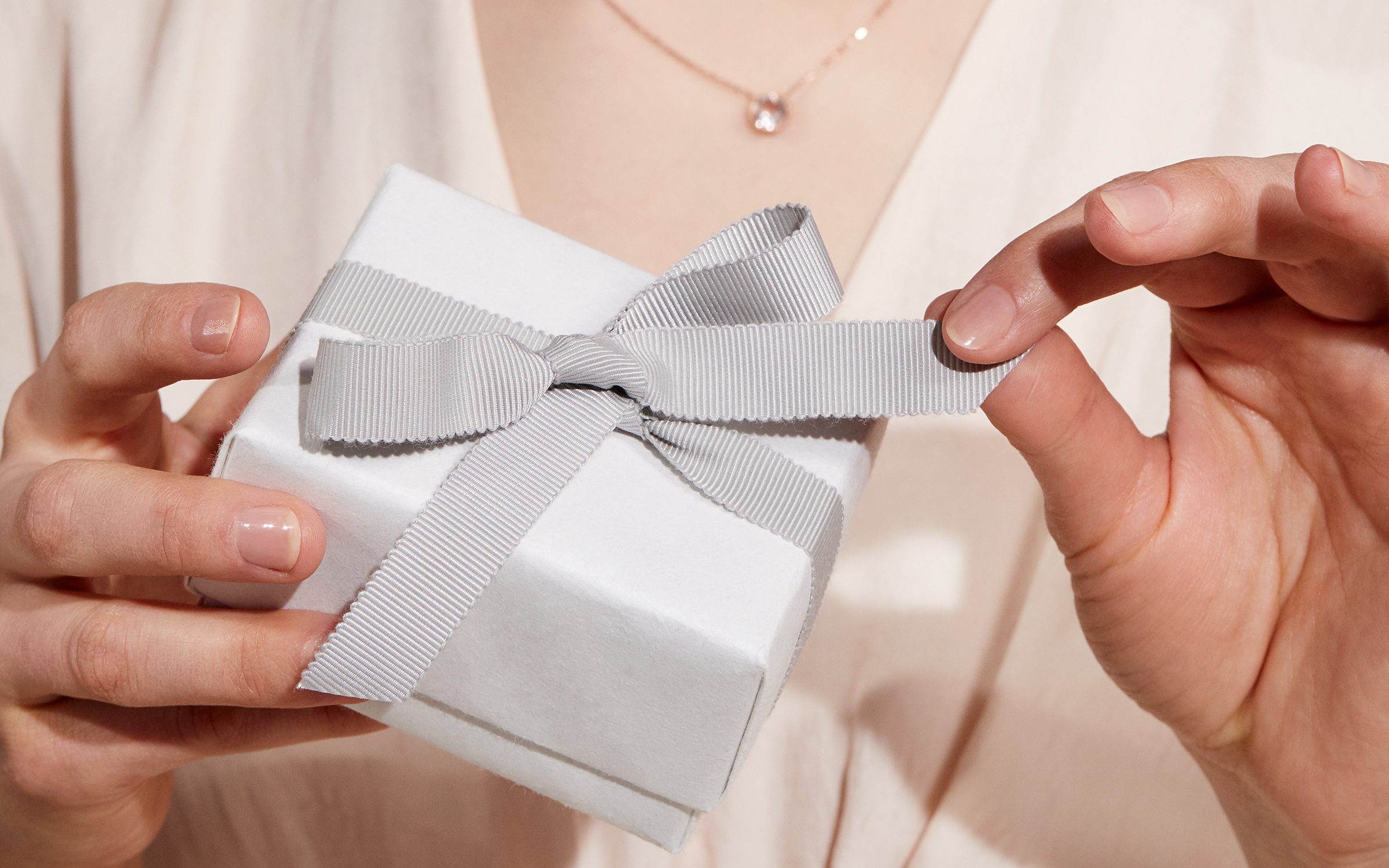 Woman opening a gift box.