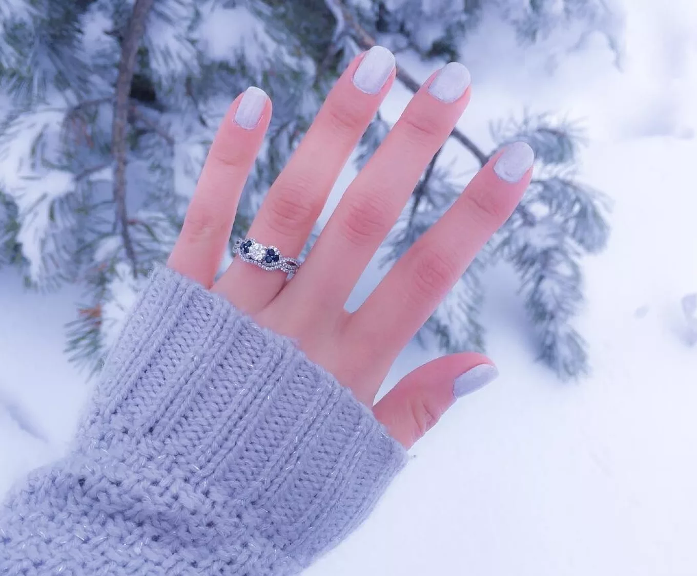 Snowy proposal Idea. Winter Proposal ideas. snowy proposal, woman showing off her engagement ring after a proposal in a snowy forest. @elenapetrovskiy

Round Sapphire and Diamond Wedding Set with Pave Setting
Add sparkle, color, and romance to your center gemstone with this gorgeous wedding set. natural diamonds are said to represent love, strength, and health. The natural sapphires have been hand-matched by Tom Shane and his team for superior color and consistency. Added nickel, zinc, silver, and copper alloys produce a bright and bold shade of 14-karat white gold that is sure to impress. Wedding sets are a great way to ensure your wedding band will fit perfectly next to your engagement ring.