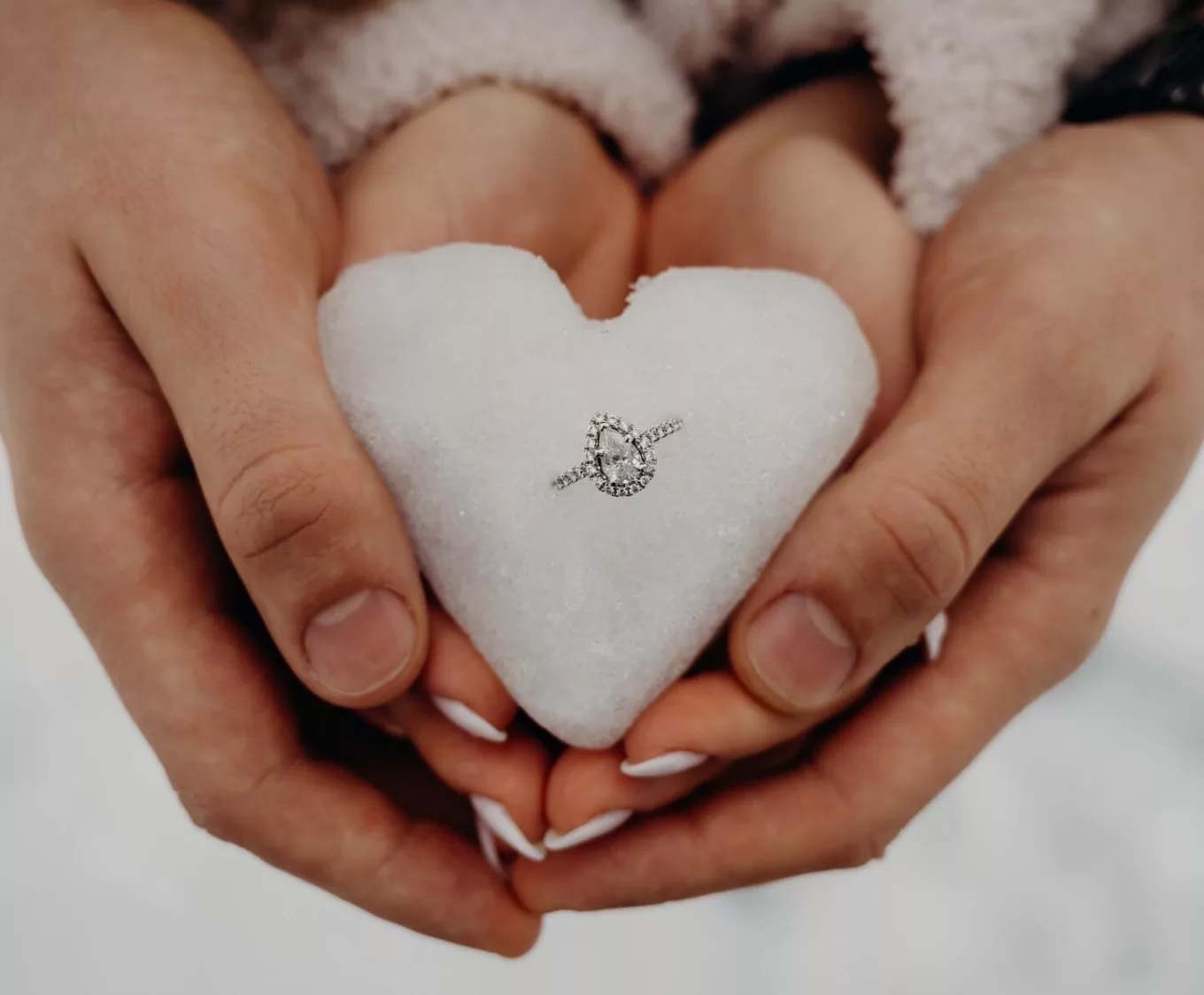 Snowball shaped into a heart with an engagement ring placed in the middle. Proposal Idea @irinachka