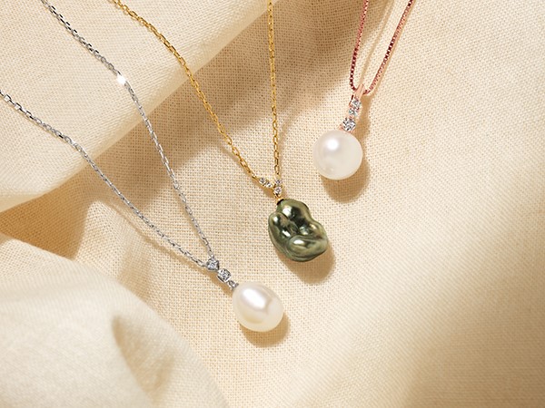 three single Pearl necklaces: white gold necklace, yellow gold necklace, rose gold and diamond necklace