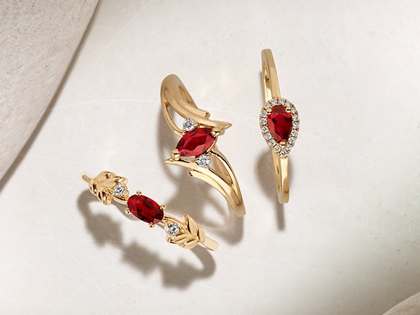 Three ruby and diamond rings.