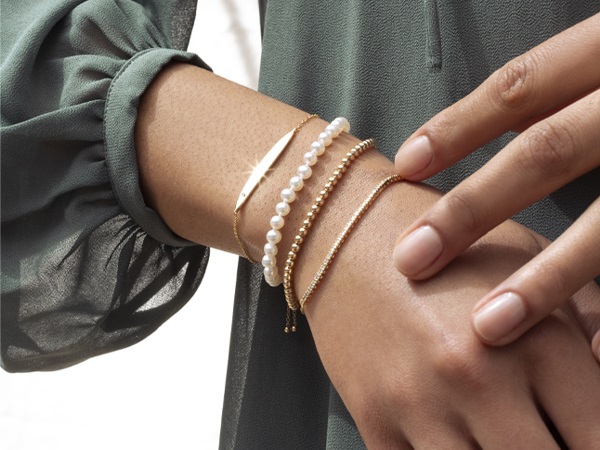 Bracelet stack with gold and pearls