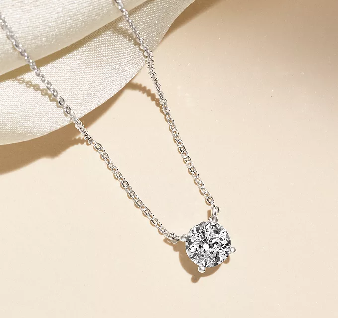 fashion solitaire diamond necklace which features a single elegant diamond pendant
