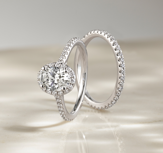 matching halo engagement ring with pave band and pave wedding band