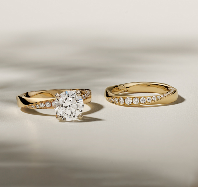 image of matching yellow gold pave wedding band and spectacular yellow gold engagement ring