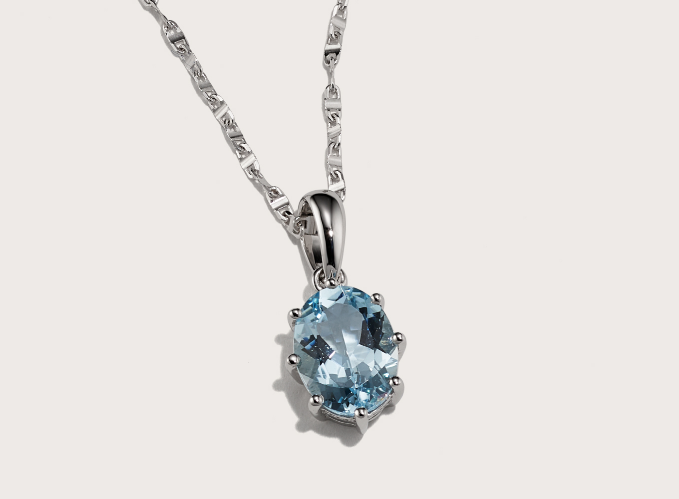 Aquamarine Pendant Necklace (18 in) Add a pop of color to any look with this gorgeous pendant necklace. The lovely aquamarine gemstone has a color that is sure to make them smile. The 14-karat white gold has added alloys that create a bright and bold color. The lobster clasp has a locking lever mechanism that will hold this necklace securely on the neck.