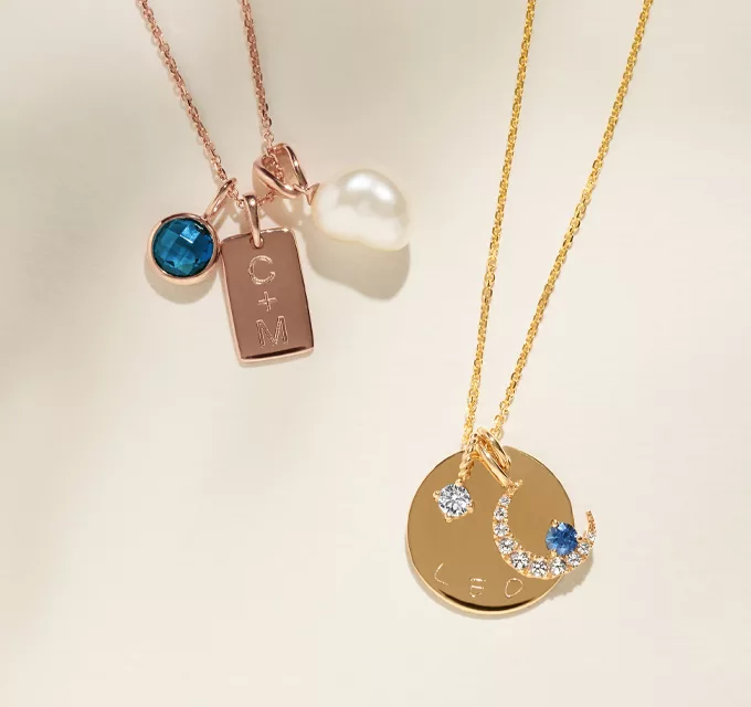 graduation gift ideas, gold charm chains, engraved and featuring multiple charm pendants: zodiac, initial, and gemstone charms