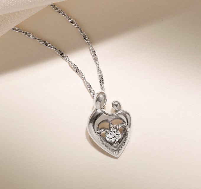 mother and child heart necklace with diamond center stone