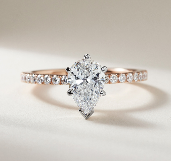rose gold engagement ring with pear shape diamond