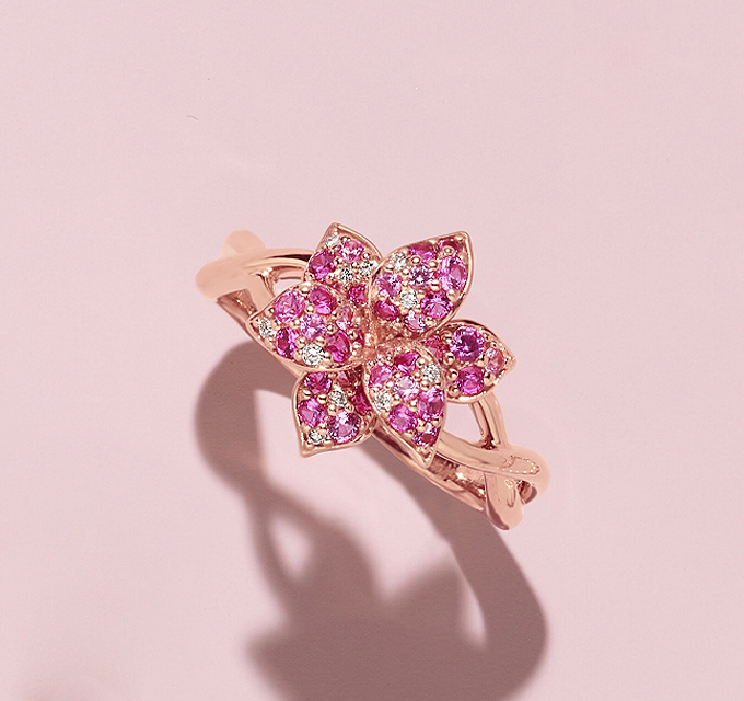 Mosaic 2 ct. Pink Sapphire and Diamond Ring. Crafted in quality 14 karat rose gold, 88 round pink natural sapphires (approx. 1.80 carat TW) and 19 round natural diamonds (approx. .16 carat TW) come together to create this lovely flower ring.