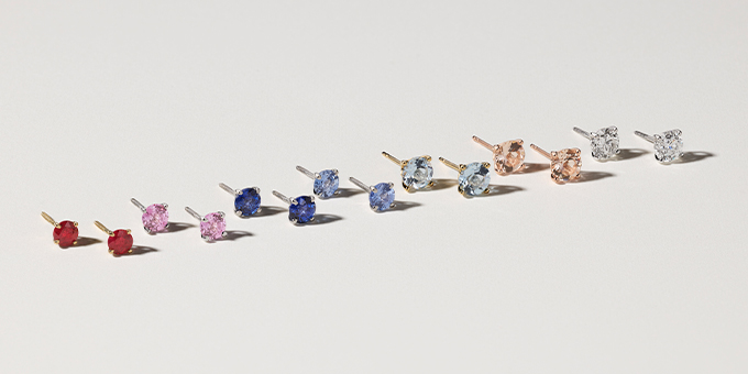assorted stud earrings in many different colors and gemstones