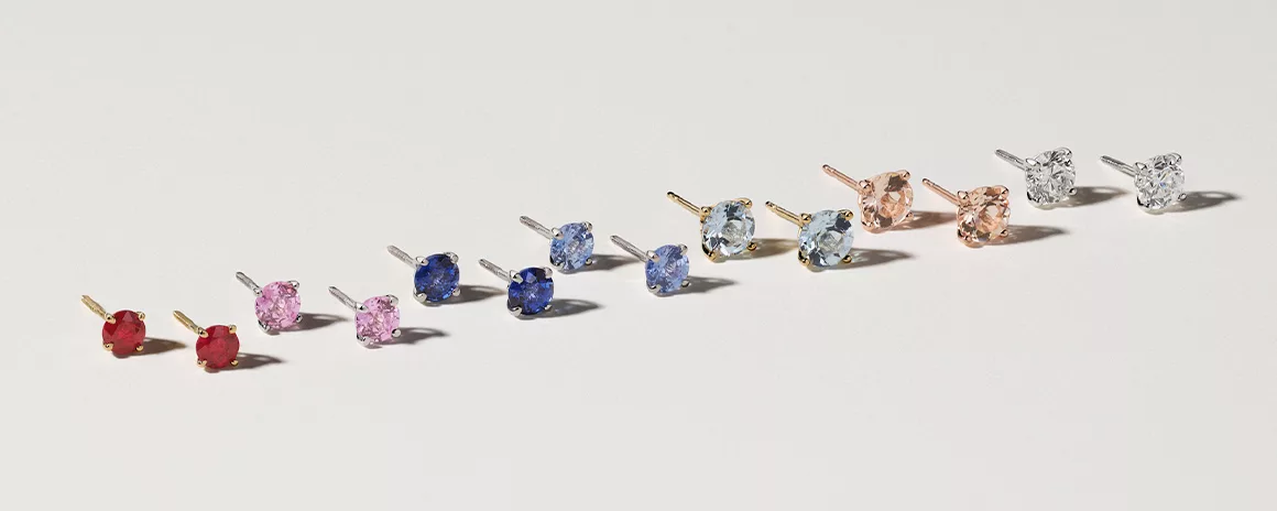 assorted stud earrings in many different colors and gemstones