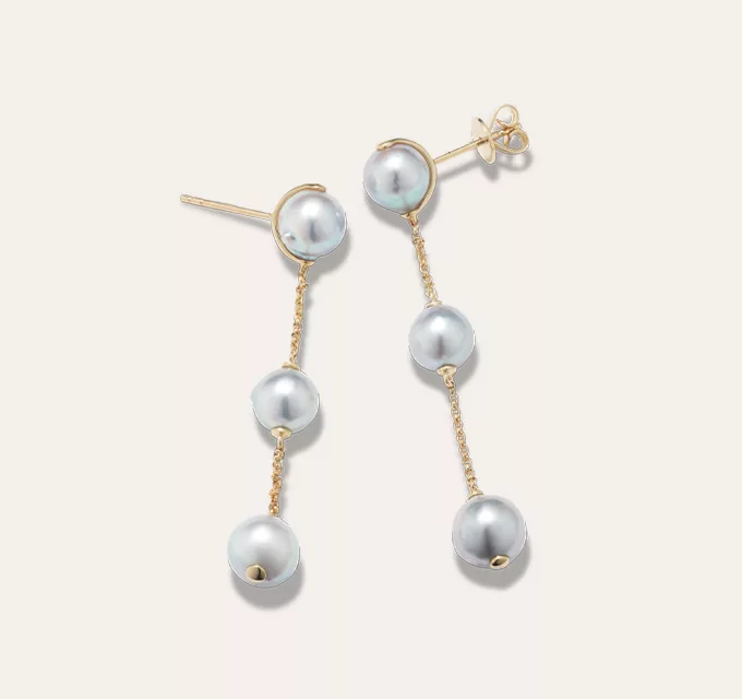 Blue Akoya Pearl Station Earrings. soft blue luster, these baroque cultured Akoya pearls seem to float along a warm 14-karat yellow gold diamond cut cable chain in these stylish station earrings. 2 baroque cultured blue Akoya pearls at 7-8mm. Station design