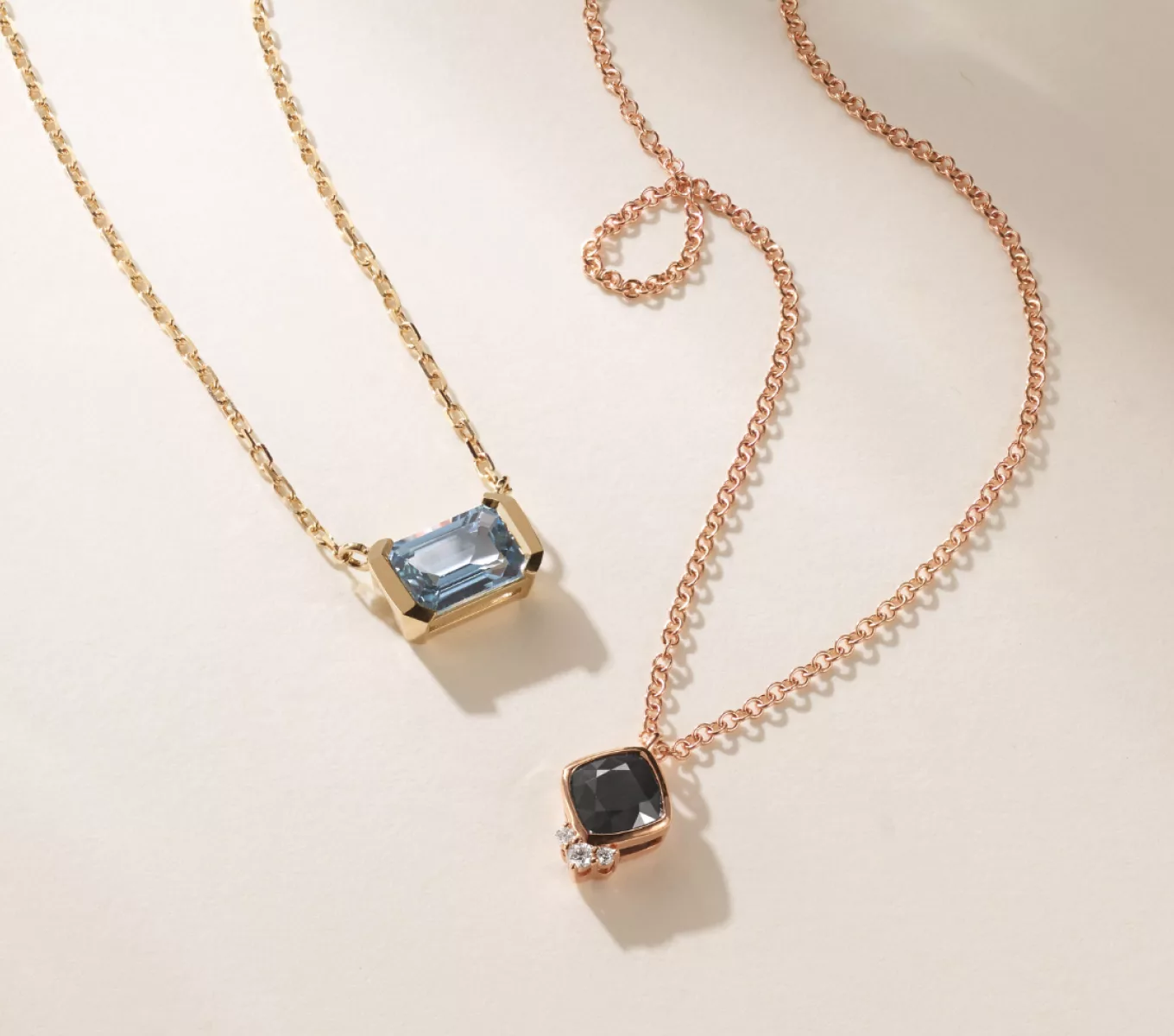 Image of Dorset Teal Sapphire Pendant in 14K Yellow Gold, Lynx Black Sapphire and Diamond Necklace in 14K Rose Gold