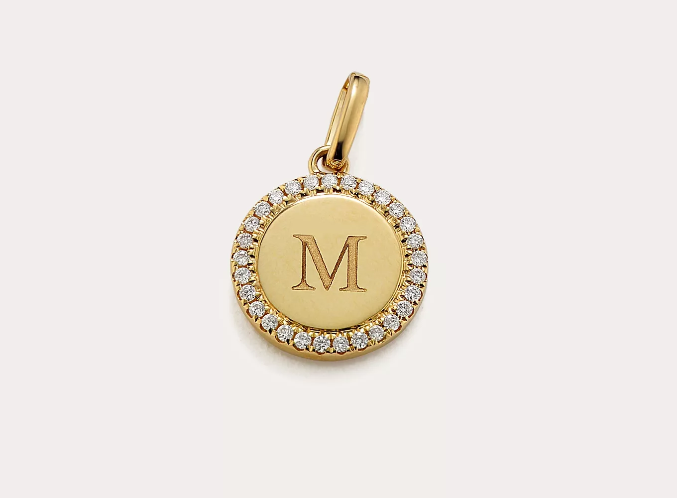 Diamond Halo Engravable Disk Charm. A border of natural diamond accents adds hand-matched sparkle and fire to this 14-karat yellow gold disk charm. Add a custom engraving to make it personal.
