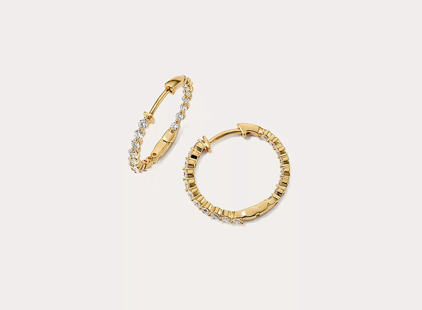 Lucia Inside-Out 1 tcw Lab-Grown Diamond Hoops The inside-out design of these hoop earrings features lab-grown diamonds along the front and along the inside back for maximum sparkle. Their beautiful 14-karat yellow gold setting highlights each diamond’s round shape.