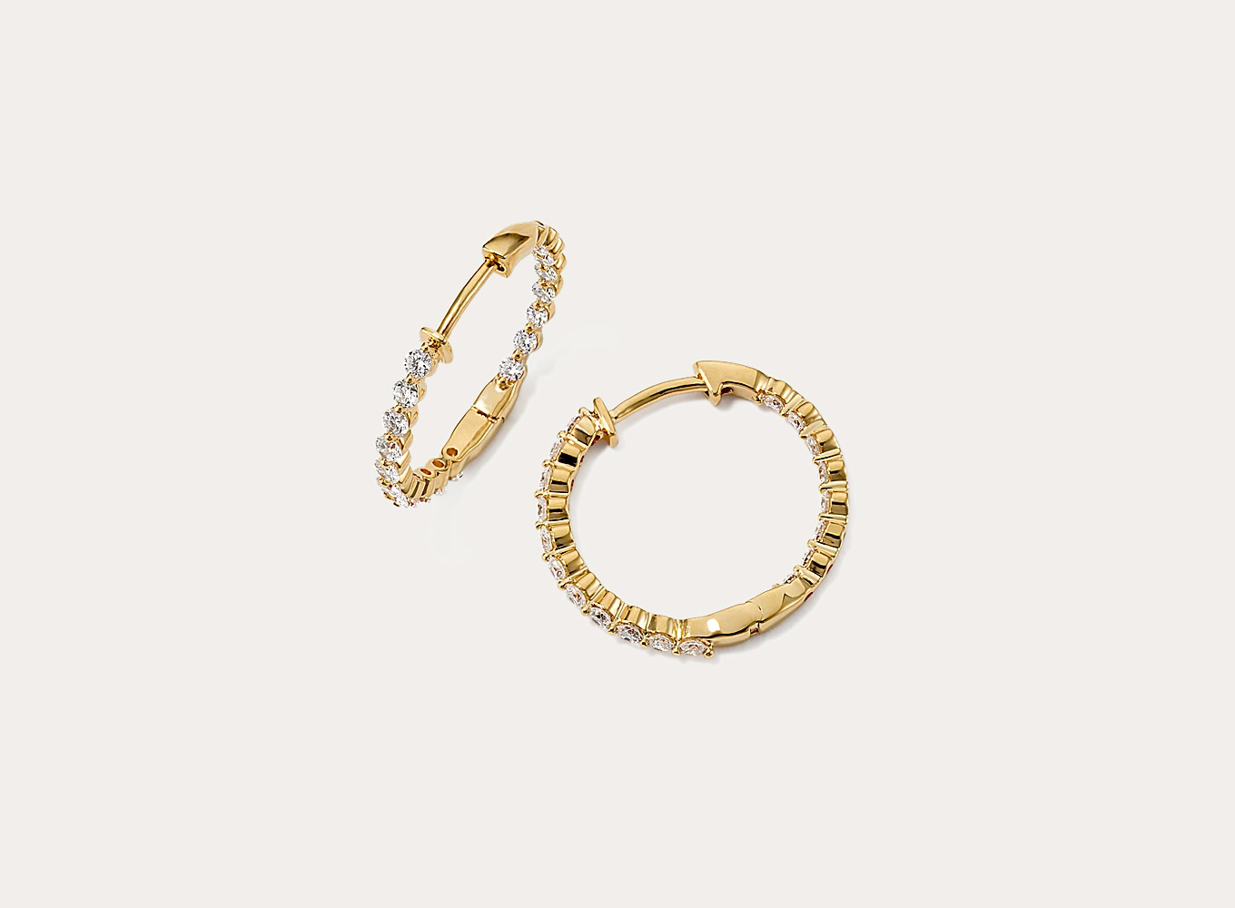 Lucia Inside-Out 1 tcw Lab-Grown Diamond Hoops The inside-out design of these hoop earrings features lab-grown diamonds along the front and along the inside back for maximum sparkle. Their beautiful 14-karat yellow gold setting highlights each diamond’s round shape.