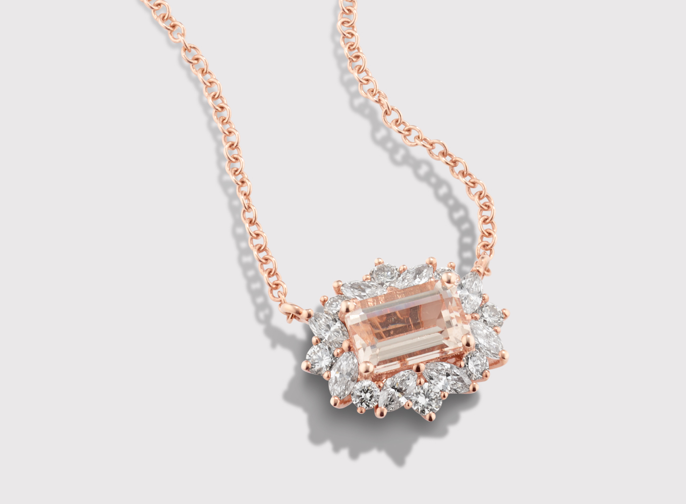 Desert Rose Morganite & Diamond Halo Pendant This gorgeous pendant features a natural peach morganite gemstone at its center. A halo of round and marquise natural diamond accents creates a floral look, while 14-karat rose gold perfectly complements the morganite gemstone. A matching rolo chain with a lobster clasp keeps this necklace secure. 