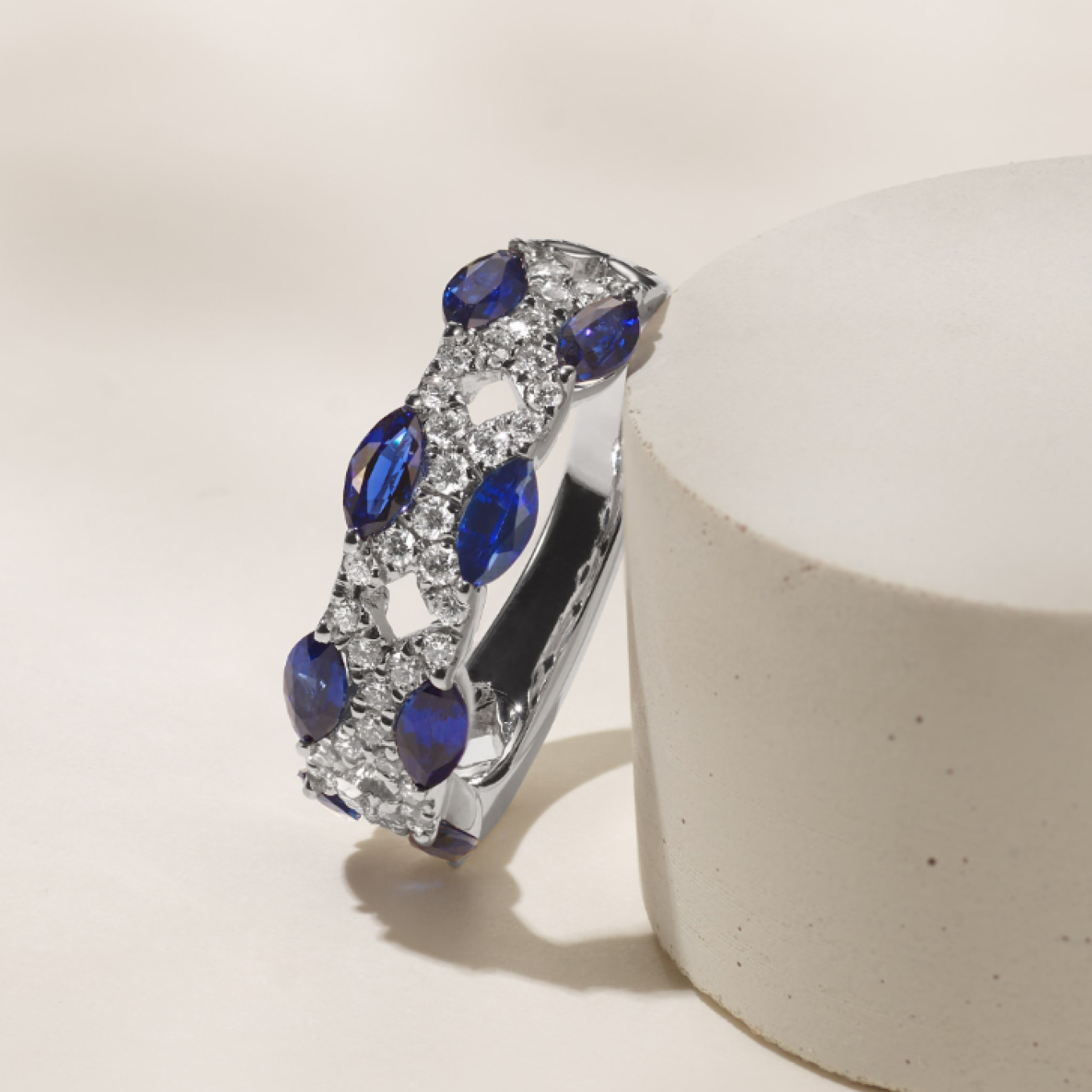 Lattice Sapphire & Diamond Band Oval natural traditional blue sapphires cling to a pavé lattice in this beautiful lacy design. Set in bright 14-karat white gold, all the gemstones in this remarkable ring are hand matched for consistent color and beauty.