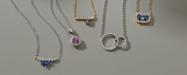 Fleur Sapphire & Diamond Necklace Three natural traditional blue sapphires in a stylish marquise shape give this dainty necklace a unique look. Crafted in quality sterling silver, it features natural diamond accents and beautiful milgrain detailing. An adjustable rolo chain and secure lobster clasp offer worry-free wear. Paige Pink Sapphire and Diamond Halo Pendant in Sterling Silver (20 in) Crafted from quality sterling silver, this lovely pendant is the perfect complement to any look. One round pink natural sapphire (approx. .30 carat TW) and sixteen brilliant round natural diamonds (approx. .05 carat TW) make up this lovely halo design. This pendant hangs from a matching adjustable 20-inch rolo chain and measures 1/2 an inch long. This pendant has a total gem weight of approximately .35 carat and is secured with a lobster clasp. Pick-Your-Gem Diamond Accent Bar Necklace The gemstone of your choice will look beautiful among the sparkling natural diamond accents in this bar pendant. A cable chain and lobster clasp keep this 14-karat white gold necklace secure. For more information on selecting your gemstone, live chat online, call a customer service representative at 1-866-467-4263, or visit one of our store locations. Yuma Diamond Intertwined Circle Necklace in 14K White Gold (18 in) This gorgeous, intertwined circle pendant is the perfect piece to complete any fine jewelry collection! Our 14-karat white gold has added nickel, copper, zinc, and silver alloys that produce a bolder, brighter shade. The natural diamonds have been hand-matched for color and clarity. The chain is adjustable so the pendant can be worn at multiple lengths, making it perfect for layering with other favorite necklaces. The piece is secured with a lobster clasp. Azula Tanzanite & Diamond Pendant An emerald cut natural tanzanite gemstone delivers its signature blue-violet color in this stunning pendant. Complete with a natural diamond halo, this 14-karat yellow gold necklace offers the perfect amount of sparkle and color.