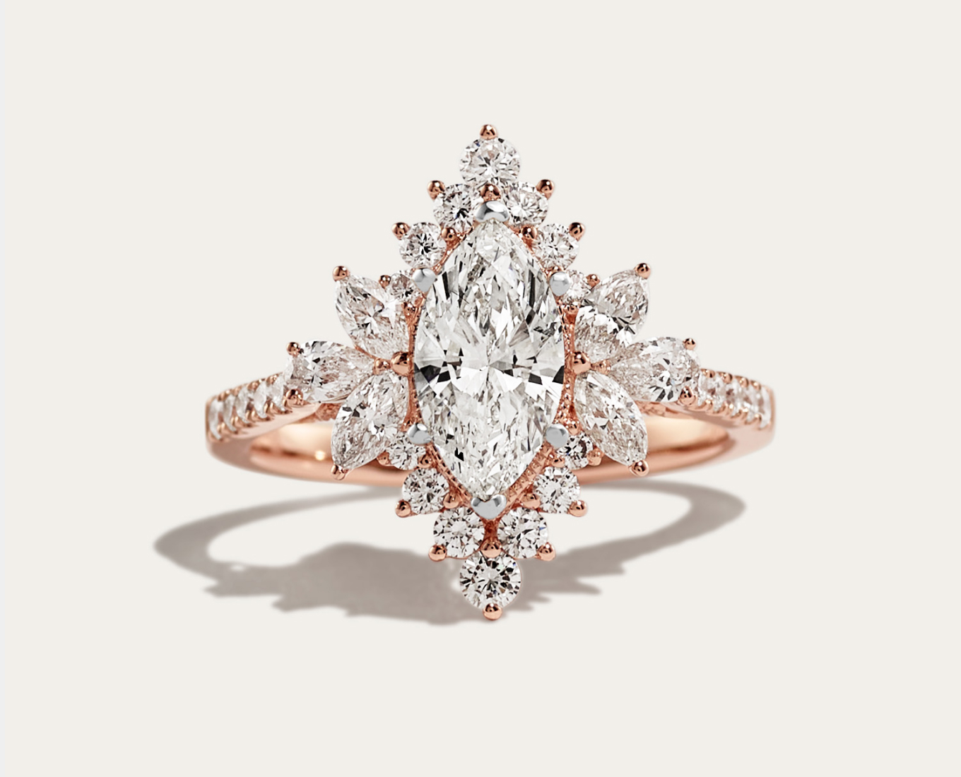 Cypress Halo Engagement Ring A showstopping halo of natural diamonds surrounds the center stone of your choice in this breathtaking engagement ring design. A mix of hand-matched marquise, pear, and round diamonds accents create unique shape, while jaw-dropping pavé dazzles along the quality 14-karat rose gold band. For more information on selecting your center stone, live chat online, call a customer service representative at 1-866-467-4263, or visit one of our store locations.