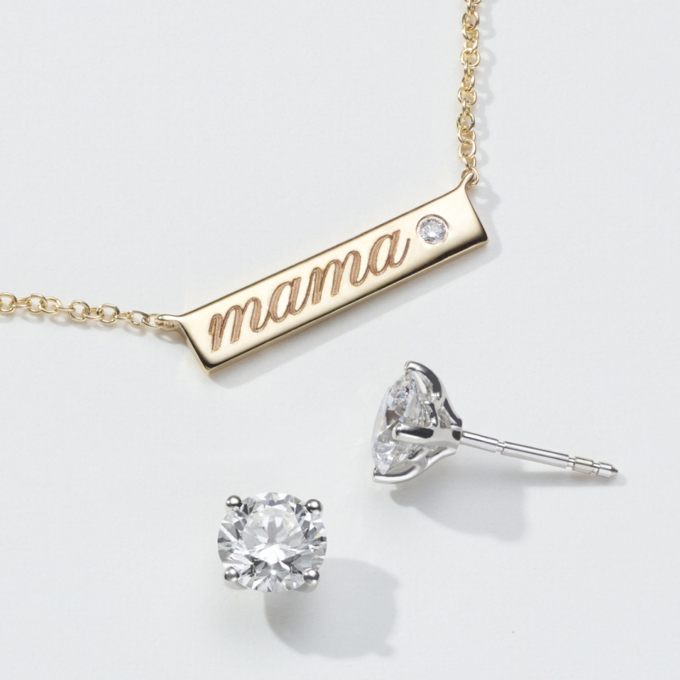 Featuring a natural diamond accent for a touch of sparkle, this this 14-karat yellow gold bar necklace is the perfect canvas for a custom engraving. A matching cable chain with a lobster clasp offers worry-free daily wear.