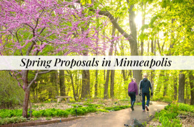 couple walking through the forest at Minnesota landscape arboretum getting ready to propose
