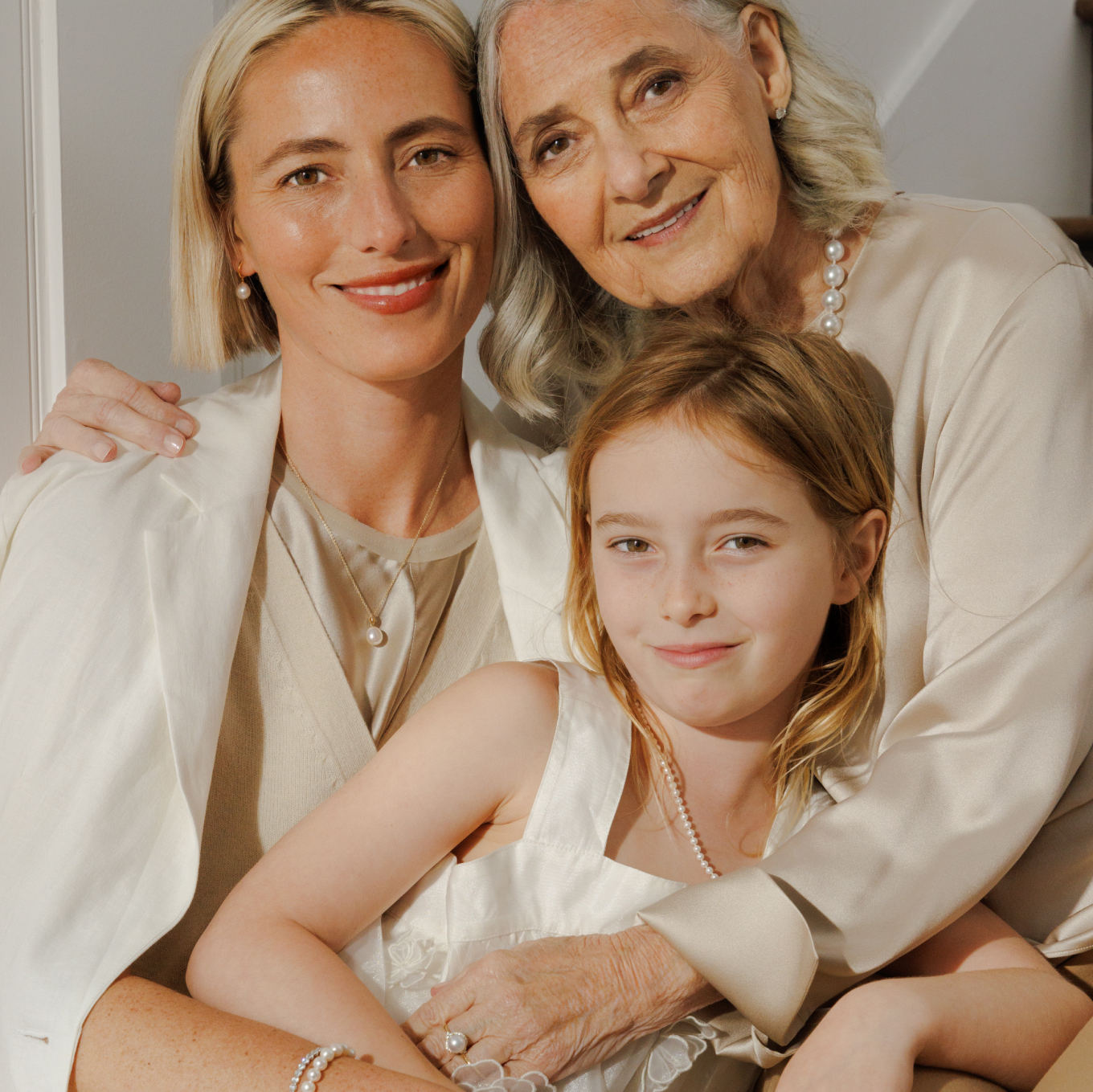 3 women, multiple generations of the same family sharing moments and history with heirloom jewelry