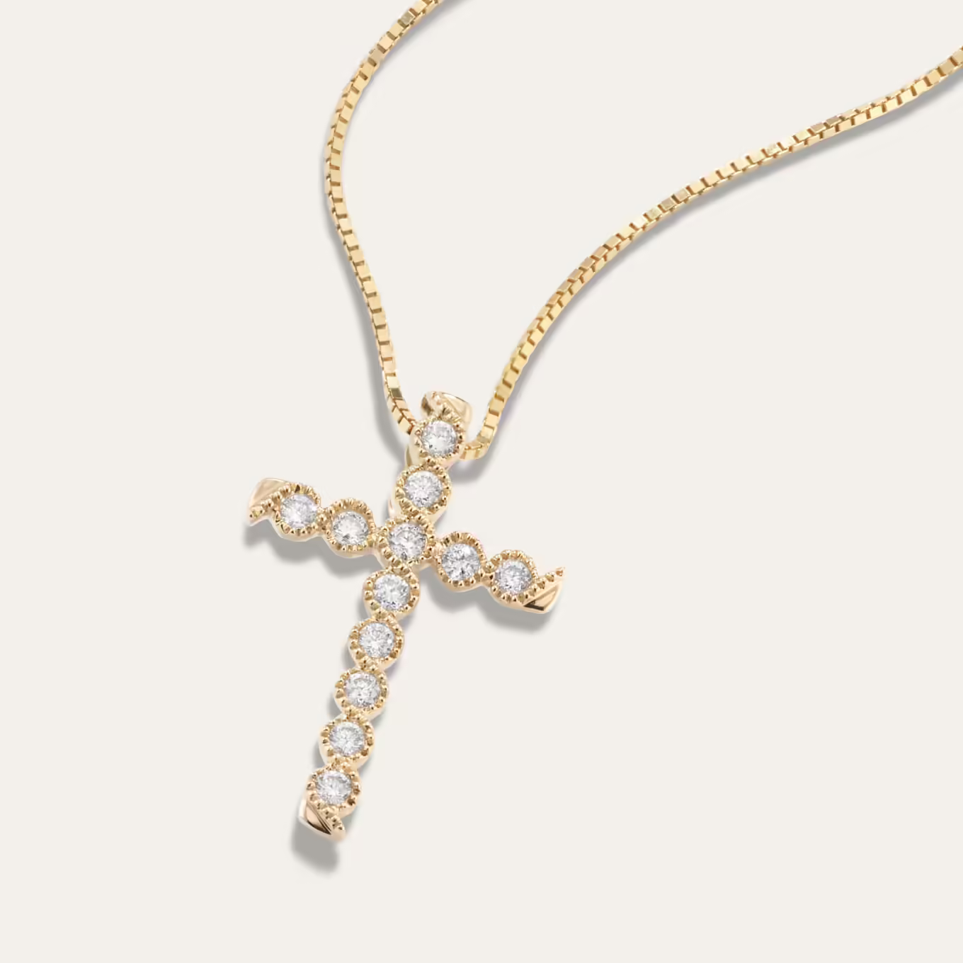 Rebecca Diamond Cross Pendant This vintage-inspired cross pendant features natural diamonds with beautiful milgrain detailing throughout the design. It’s crafted in warm 14-karat yellow gold and comes on a matching box chain with a secure lobster clasp.
