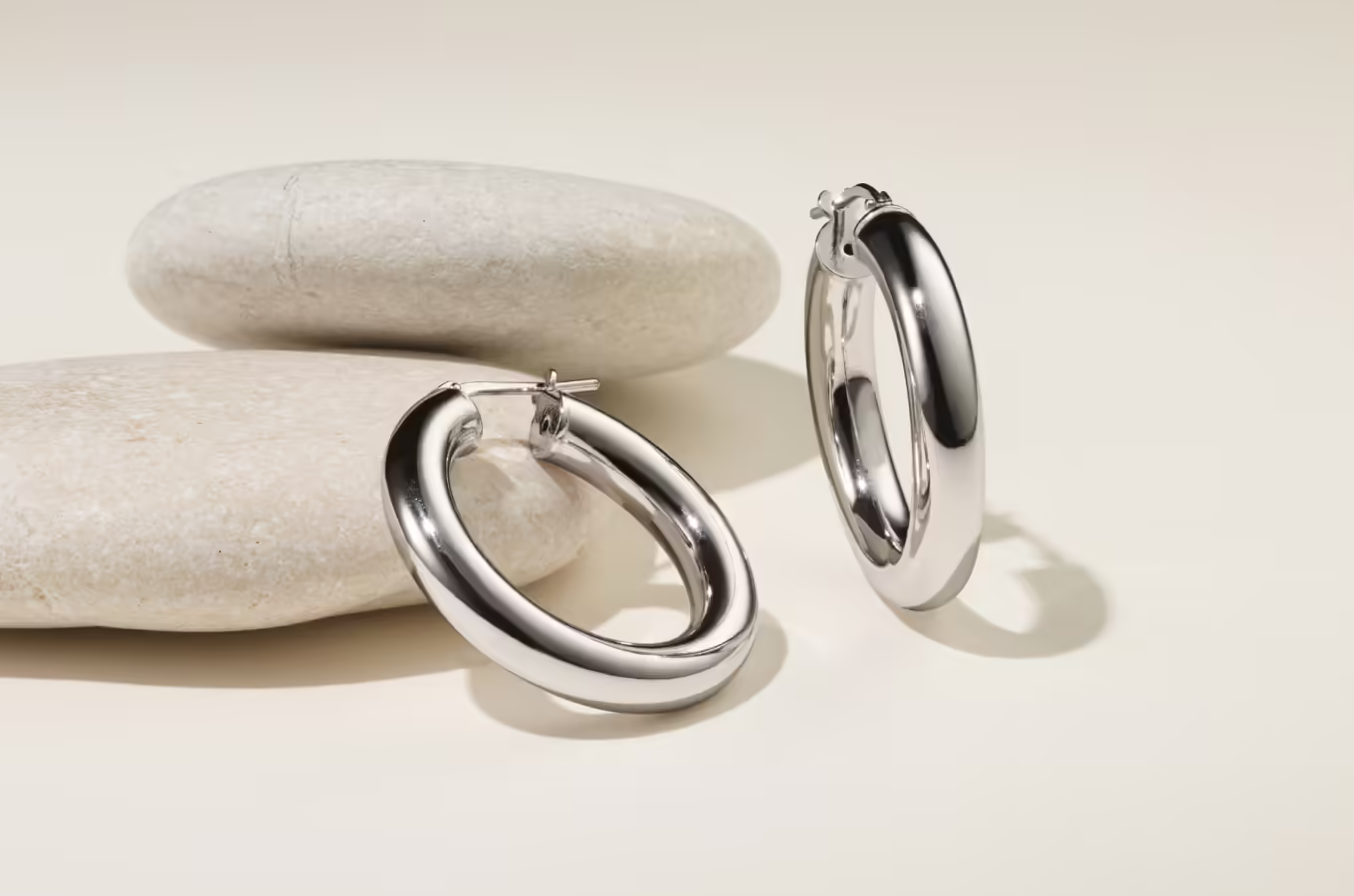 Classic Medium Sterling Silver Hoops These sterling silver hoops have a classic rounded profile and lightweight feel that’s perfect for every day. A lever back keeps these stylish earrings secure. Approx. 3/4-inch diameter Lever back Sterling silver