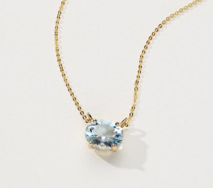 Pick-Your-Gem Pendant (11x9mm Oval) Whether opting for a birthstone or a favorite gemstone, the unique east-west (horizontal) setting of this 14-karat yellow gold pendent is a beautiful way to display the oval gemstone of your choice. A matching diamond cut cable chain with a lobster clasp keeps this necklace secure. Best fits an oval 11x9mm gemstone or 3.75 ct. diamond Center stone sold separately 18-inch adjustable diamond cut cable chain Lobster clasp 14k yellow gold The image showcases a delicate and elegant necklace. The necklace features a fine gold chain that holds a single, prominent gemstone pendant. Chain: The chain is made of gold, with a fine and delicate link pattern that adds to the necklace's overall elegance and sophistication. Pendant: The pendant is an oval-shaped gemstone, likely an aquamarine or a blue topaz, given its light blue color. The gemstone is set in a classic four-prong setting, which allows maximum light to pass through the stone, enhancing its brilliance and sparkle. The background is a plain, light color, which highlights the necklace and its details. The overall presentation is simple yet refined, emphasizing the beauty of the gemstone and the fine craftsmanship of the necklace. This piece appears to be designed for elegance and everyday wear, adding a touch of sophistication and color to any outfit.