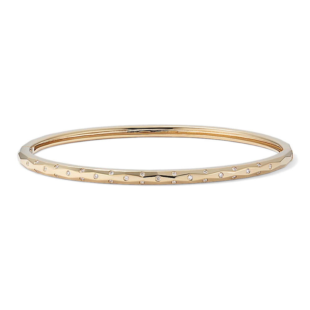 Quinn Geometric Diamond Bangle Bracelet Natural diamonds dot this 14-karat yellow gold bangle bracelet with beautiful sparkle. This stylish bracelet also features a fun geometric shape and a hidden box clasp for a seamless look. 28 round natural diamonds at approx. 0.15 tcw Hinged bangle design 8-inch length Hidden box clasp 14k yellow gold