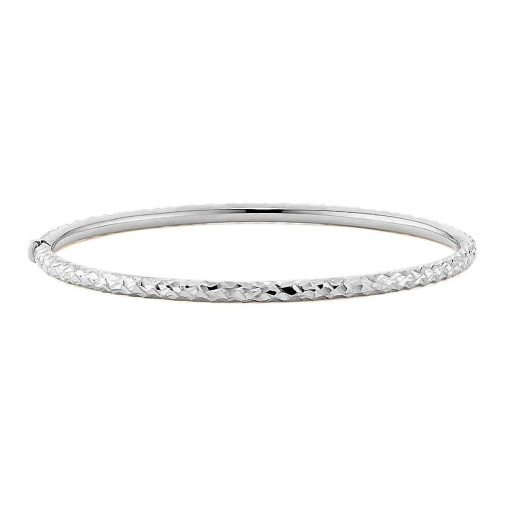14K White Gold Textured Bangle Bracelet This 14-karat white gold bangle bracelet features a textured finish, offering beautiful shine to any look. A secure box clasp offers worry-free wear. Hinged bangle design 7.5-inch length Box clasp 14k white gold