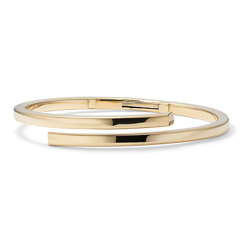 14K Yellow Gold Bypass Bangle Bracelet
This 14-karat yellow gold bypass bangle bracelet offers an elegant yet modern look with its sleek wraparound design. For more information about custom engraving on the interior or exterior of this piece, live chat online, call a customer service representative at 1-866-467-4263, or visit one of our store locations.

Hinged bangle design
7.5-inch length
14k yellow gold
Engravable inside and outside